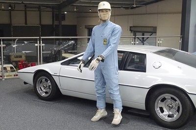 Lot 53 - Original Sir Stirling Moss race suit on mannequin, complete with signed replica gloves and helmet